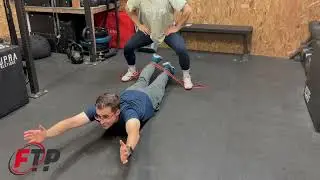 Partner Banded Flutter Kicks in Superman Hold while Sumo Squat Hold