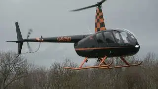 ROBINSON R44 G-ROMT LANDING AND DEPARTING FROM CHELTENHAM RACECOURSE HELIPORT 16-3