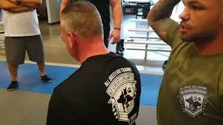 Thiago Alves demonstrates the rear naked choke during a K9 aapprehenshion