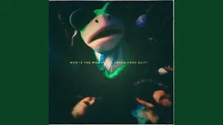 Who is the man in the green frog suit