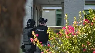 Woman shot and killed, man in custody after shooting at Gilbert extended stay