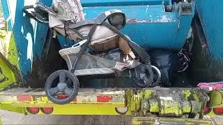 Garbage truck crushing strollers, car seats and baby walker