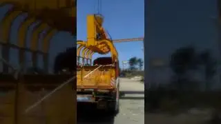 Hydraulic grab unloading from truck