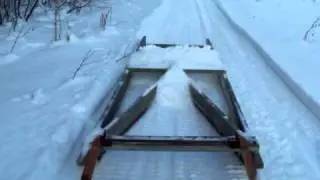 Grooming the ski-doo  trail with homemade drag