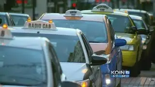 Uber, taxis fight over rules for rideshares