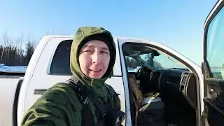 ice fishing for pike off the ice road