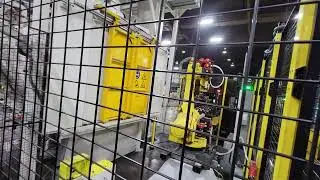 Steel Crank Shafts from Fixtures Conveyor to Mag line