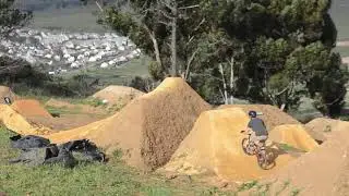 Rikus bmxing at Hellsend dirt jumps