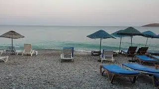 Beach Bed and Chairs Lined up in the Sea Shore