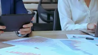 Office workers hands typing on their devices