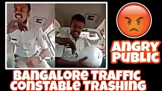 Traffic Police Constable Trashing A Common Man and Public Against Traffic Cops For there Behaviour.