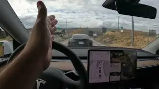 Tesla FSD handles freeway merge in traffic like a pro.