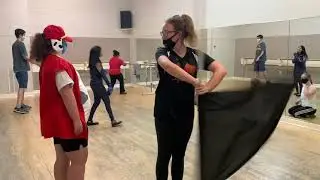 Emily twirls flag at TDC