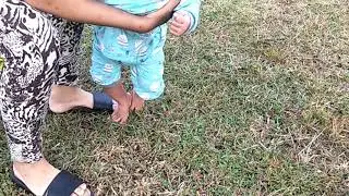 Baby afraid of grass