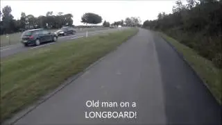 Old man on a longboard