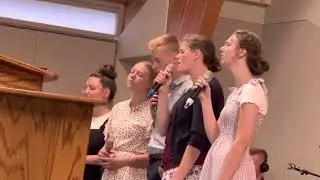 Doell family with Esther sing special