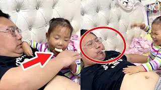 A girl and her father eat cream on the belly! So delicious.