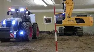 Liebherr 946 loads Claas Xerion with hook lift trailer