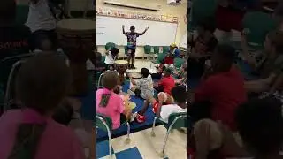 Drum circle at school. Exercise conducting a drum circle