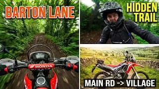TRF GRMUID 11328 Barton back lane on motorbikes from the main road to the village.