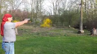 Dad shooting in backyard.