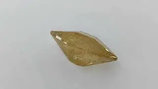 Quartz with rutile inclusions. (Brazil.) For sale $200 8.15 carats. 19.3/11.2/8.8 mm. . 