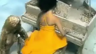 Girl plays piano underwater in dress