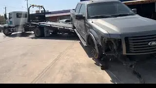 Snatch blocking a truck on a flatbed tow truck and double loading