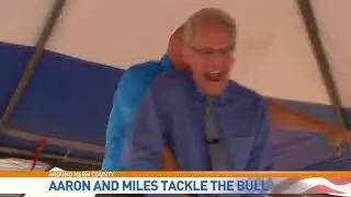 Two Weather Forecasters Ride a Mechanical Bull