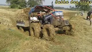 Farmtrac 45 tractor stuck in deep mud with heavy load.