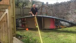 Pulling a pinned boat off a rock using the canoe roll over method