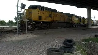 UP 9514 GE C41-8W with a UP GP20 and a Flag Dash 9 lead Mixed Freight in North Houston TX / 5/2015
