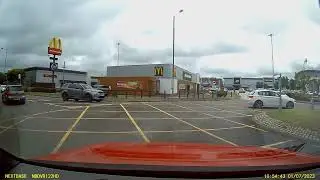 BF05TGK Zombie taxi driver pulls out on car on roundabout