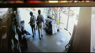 Couple stealing umbrella