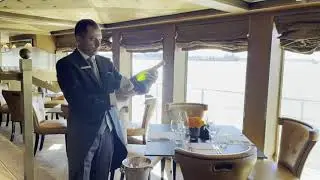 Sabering Champagne on a Uniworld cruise ship.