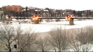 Thousands gather to witness demolition of historic bridge