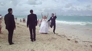 Punta Cana beach wedding photo shoot of well endowed bride almost losing top