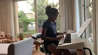 Nine years old (Joanne Benjamin) performing Piano