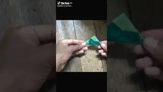 How to fold money into a triangle shape  