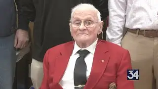 Funeral home celebrates local veteran's 100th birthday with donation to resource center