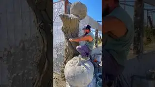 Support columns made of artificial concrete. Wood texture. Опорные колонны из искусственного бетона.