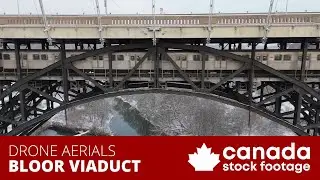Royalty Free 4K stock video. Drone aerial Bloor Viaduct TTC subway train. Toronto Winter Don Valley