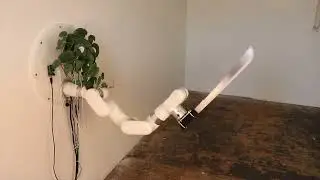 living plant controls a machete through an industrial robot arm