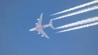 A nice cruising Emirates Airbus A380-861 trailing overhead in clear skies at 33,000 ft