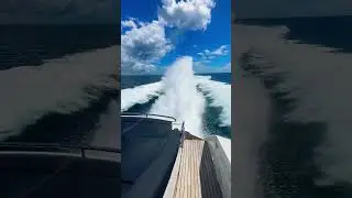 Sport Yacht throwing a rooster tail at 45 knots the Pershing 64 X