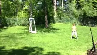 Hitting golf balls at a glass door