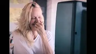 Pamela, a love story (2023) - opening scene - Pamela Anderson watches herself on old home movies.
