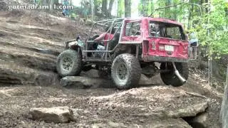 Jeep Cherokee Climbs Axle Hill at Trucks Gone Wild