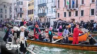 WATCH NOW: Carnival Magic in Venice Grand Canal Hundreds of Boats Create Stunning Spectacle | AQ14