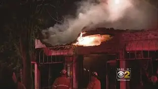 Firefighters Monitor Fire Site In Elmhurst